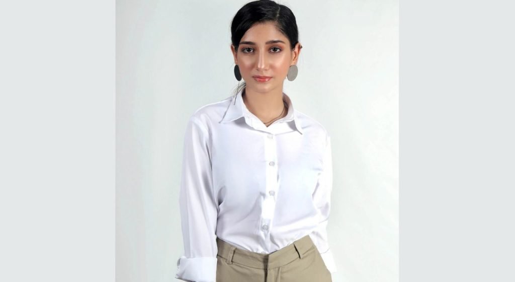A girl wearing Classic Button-Down Blouse
