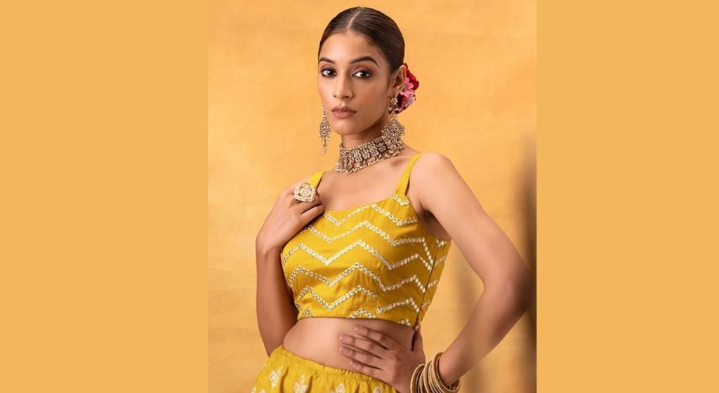 A pretty girl wearing a Crop Blouse.