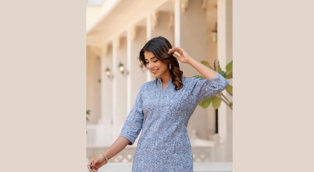 A pretty girls wearing a beautiful tunic blouse
