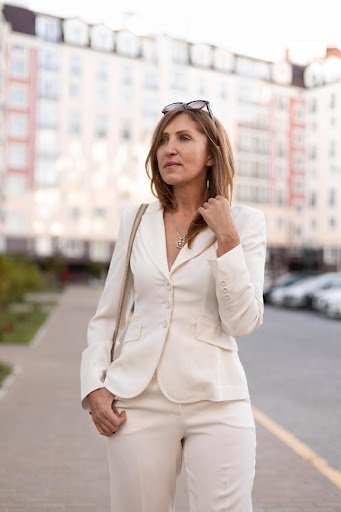 Girl over 40 wearing office attire.